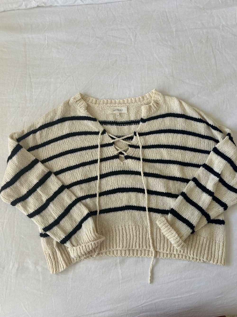 THE GREAT. Cream and Black Striped Lace-Up V-Neck Sweater